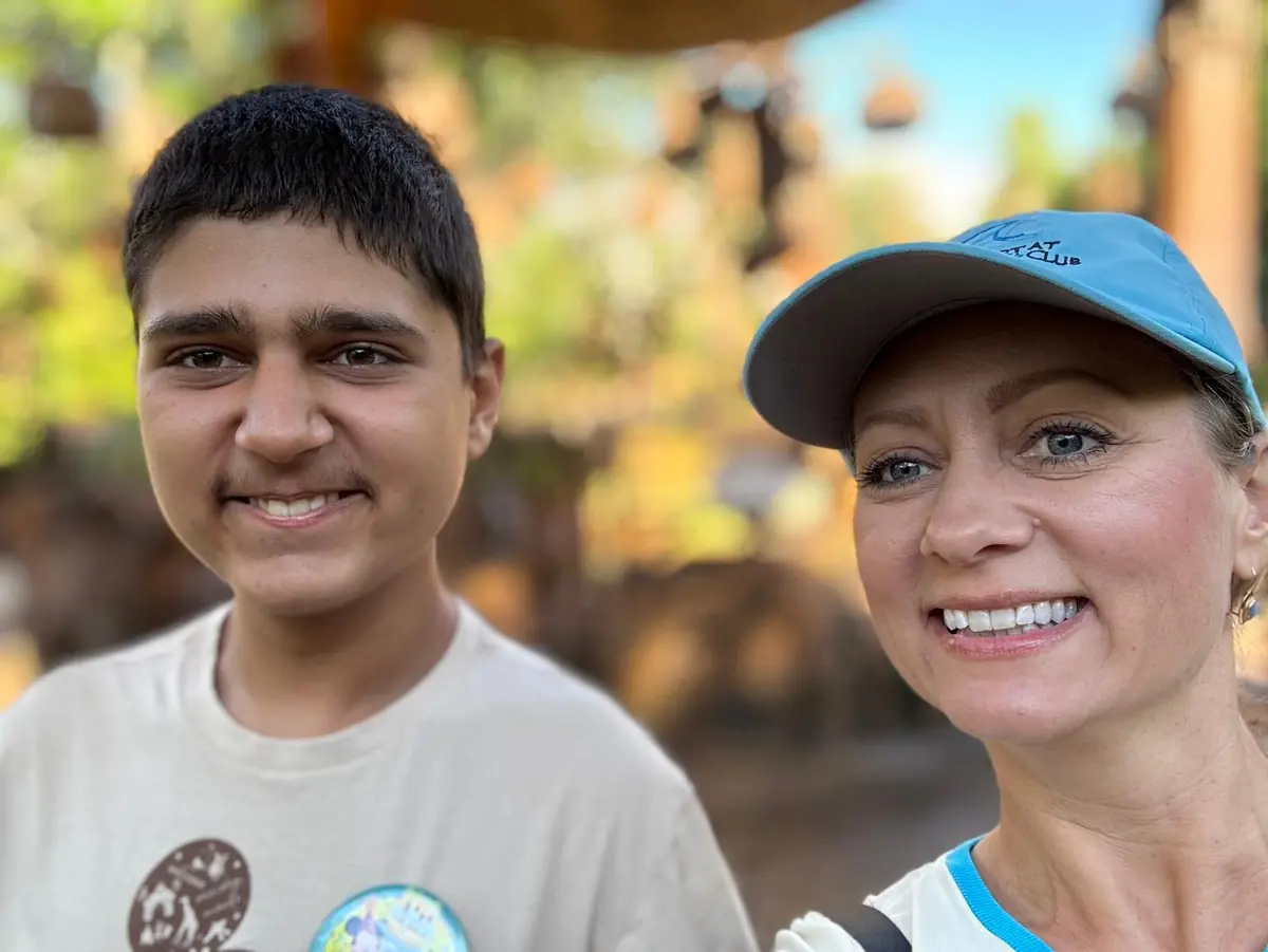 Olga smiling in a selfie with her son on a sunny day out